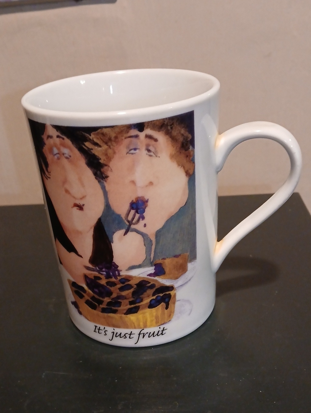 White Porcelin Mug Signed with Illustrated Couple and 'It's Just Fruit' Text.